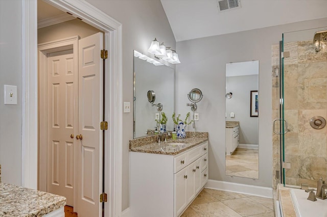 bathroom with two vanities, visible vents, a sink, a shower stall, and baseboards