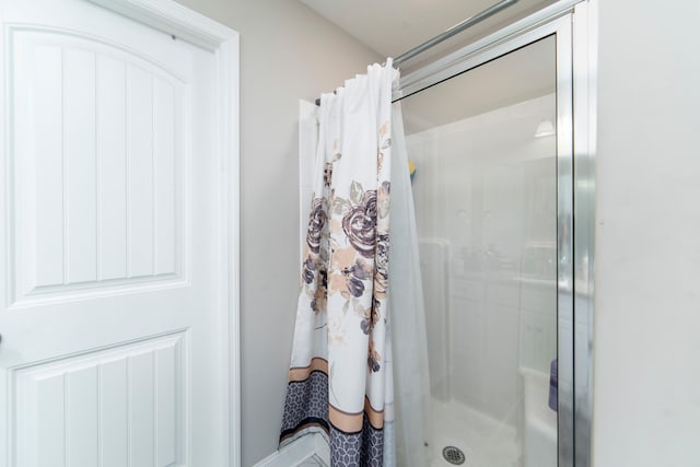 bathroom with a shower with curtain