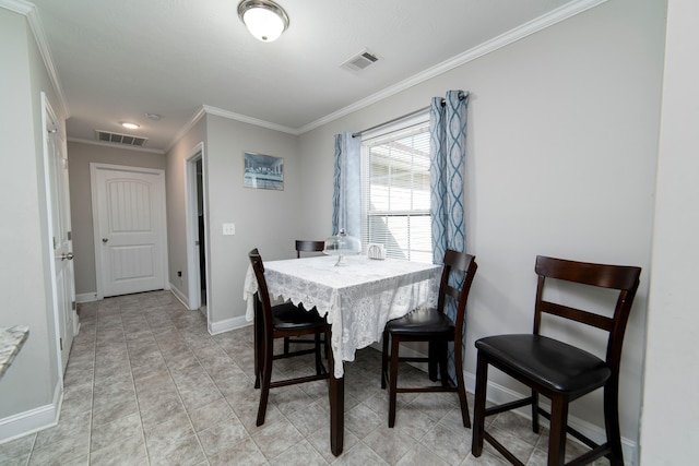 dining space featuring ornamental molding