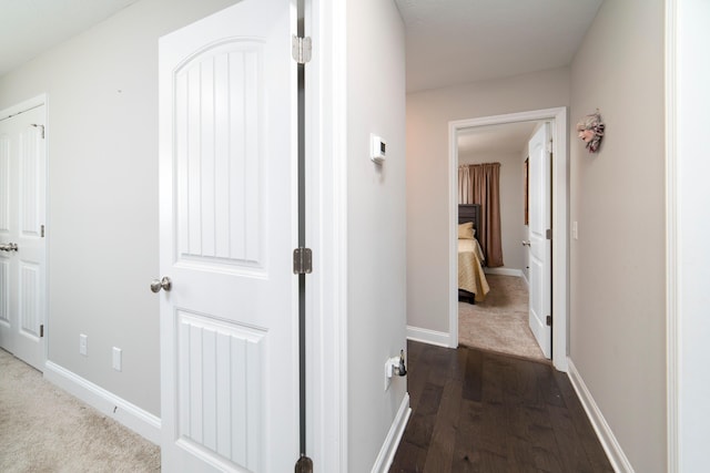 corridor featuring dark hardwood / wood-style floors