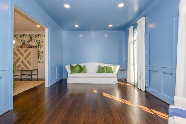 unfurnished room with a decorative wall, recessed lighting, ornamental molding, wainscoting, and hardwood / wood-style floors