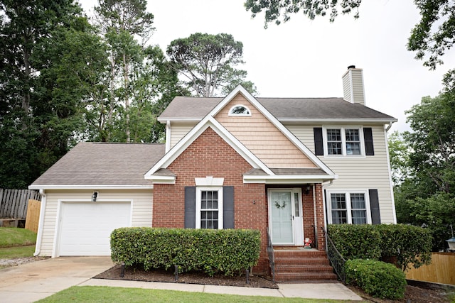 3943 Carson Cutoff, Martinez, GA 30907 - view of front of house featuring concrete driveway, a chimney, an attached garage, brick siding, and a shingled roof