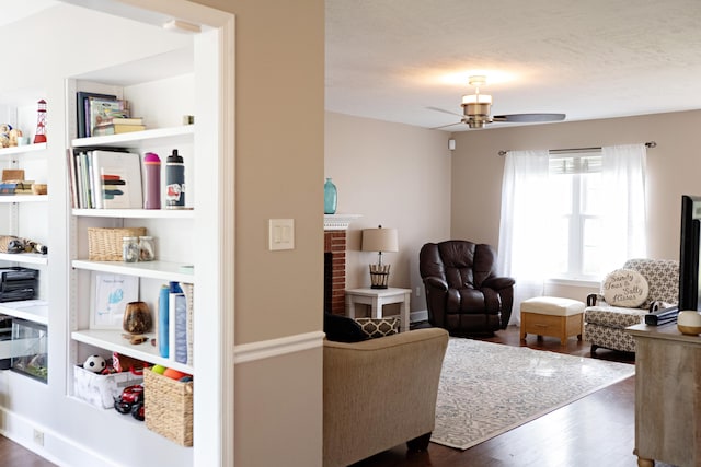 3943 Carson Cutoff, Martinez, GA 30907 - living area featuring dark wood-type flooring, ceiling fan, and a brick fireplace