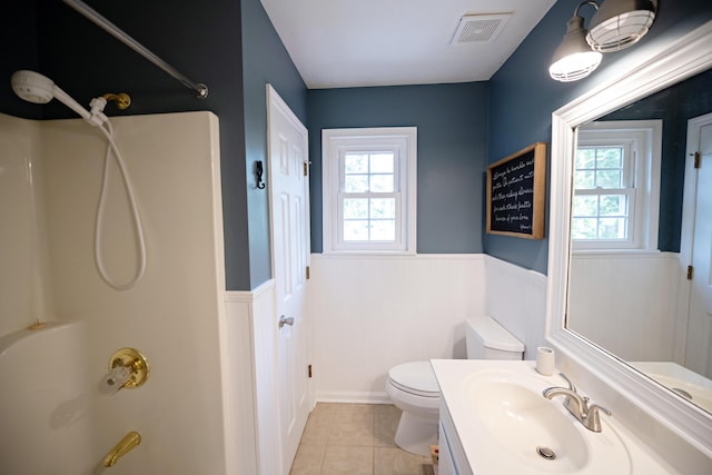 3943 Carson Cutoff, Martinez, GA 30907 - bathroom featuring wainscoting, healthy amount of natural light, vanity, tile patterned flooring, and shower / washtub combination