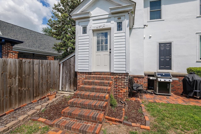 2442 Mcdowell St, Augusta, GA 30904 - property entrance featuring fence, stucco siding, and brick siding