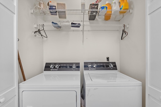 laundry room featuring washing machine and clothes dryer and laundry area
