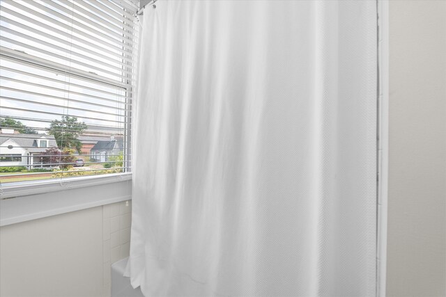 2442 Mcdowell St, Augusta, GA 30904 - bathroom with a shower with shower curtain