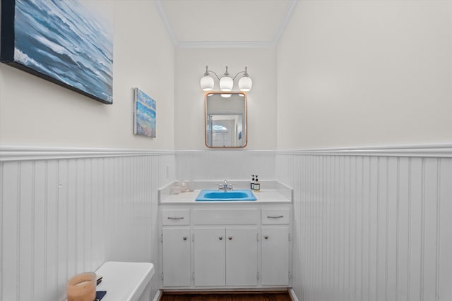 2442 Mcdowell St, Augusta, GA 30904 - bathroom with vanity, ornamental molding, and a wainscoted wall
