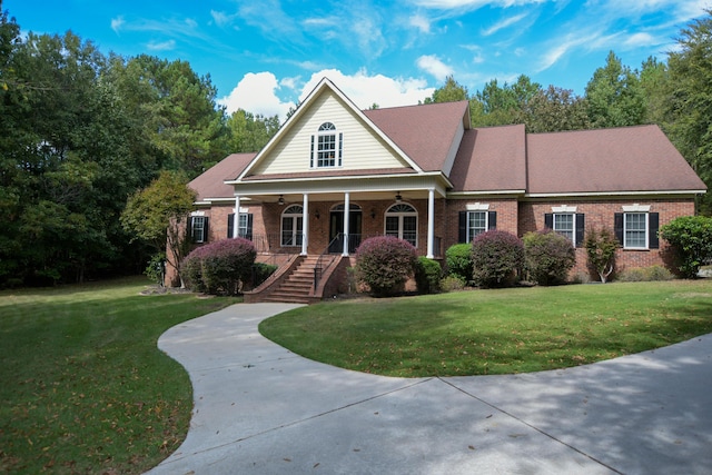 view of front of property featuring a porch and a front lawn