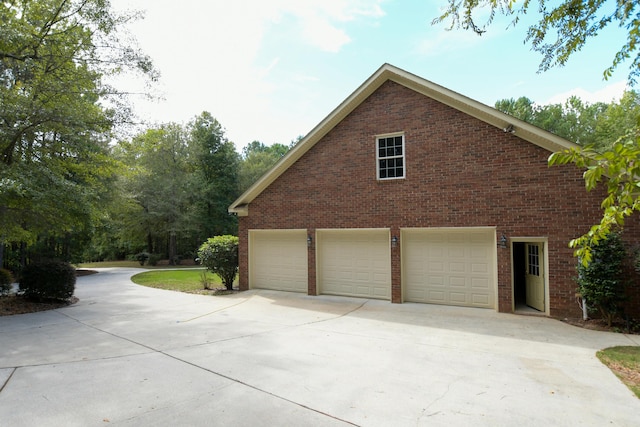 view of side of home featuring a garage