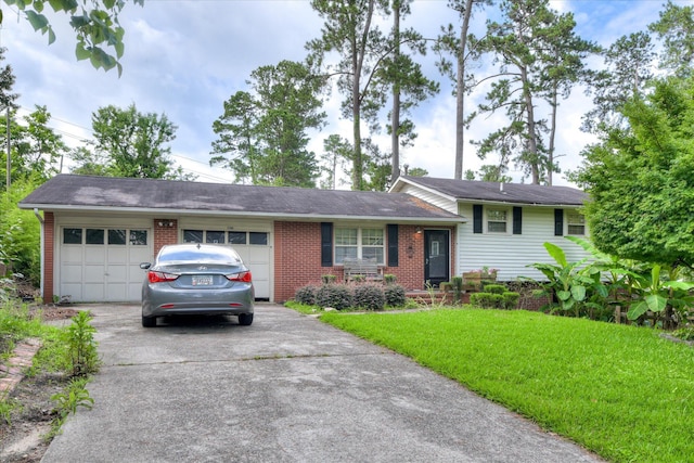3364 Wedgewood Dr, Augusta, GA 30909 - tri-level home featuring a garage, concrete driveway, brick siding, and a front lawn