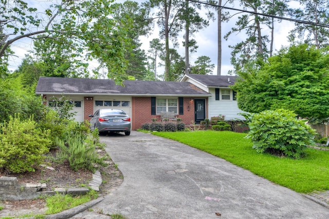 3364 Wedgewood Dr, Augusta, GA 30909 - split level home with a garage, brick siding, driveway, and a front lawn