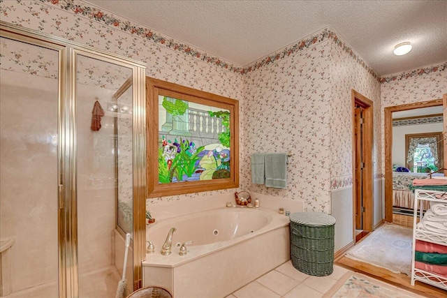 bathroom with tile patterned flooring, a textured ceiling, and independent shower and bath