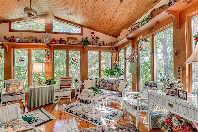 sunroom / solarium featuring ceiling fan, wooden ceiling, and vaulted ceiling