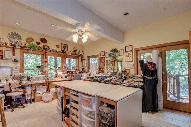 kitchen featuring beamed ceiling, light carpet, and ceiling fan