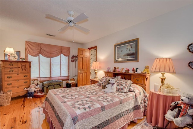 bedroom featuring ceiling fan and light hardwood / wood-style floors