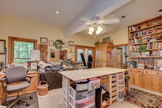 carpeted office space featuring beamed ceiling, french doors, and ceiling fan