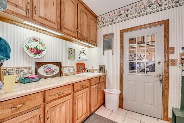 interior space with sink and light tile patterned floors