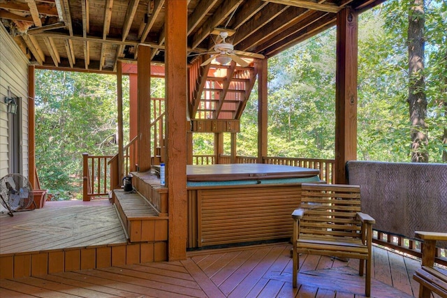 deck with ceiling fan and a hot tub