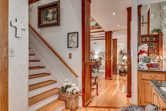 stairs with hardwood / wood-style floors