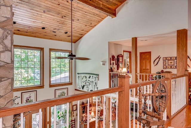 hallway featuring vaulted ceiling with beams, hardwood / wood-style flooring, and wooden ceiling