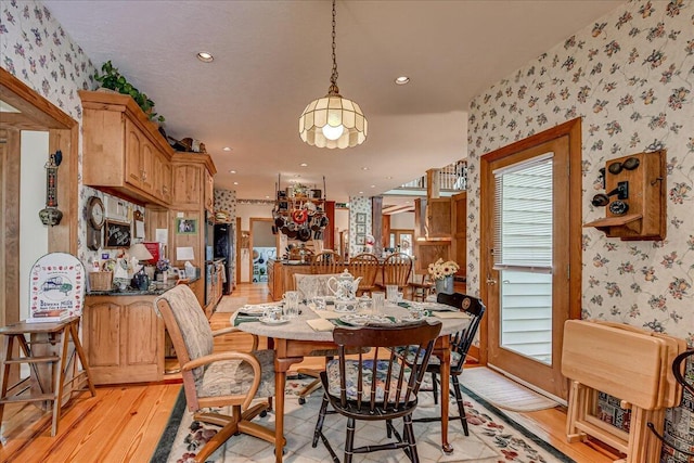 dining room with light hardwood / wood-style floors