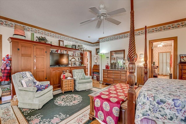 bedroom with a textured ceiling, ceiling fan, and ornamental molding