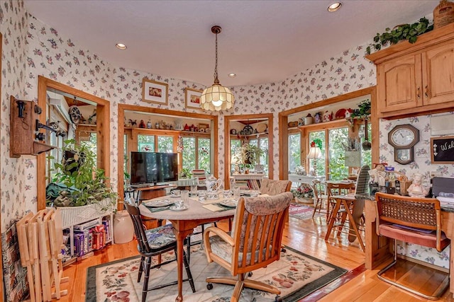 dining area featuring light hardwood / wood-style floors and a wealth of natural light