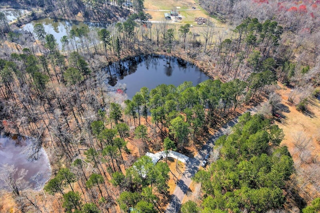 drone / aerial view with a water view and a wooded view