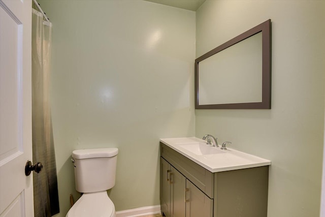 full bathroom featuring vanity and toilet