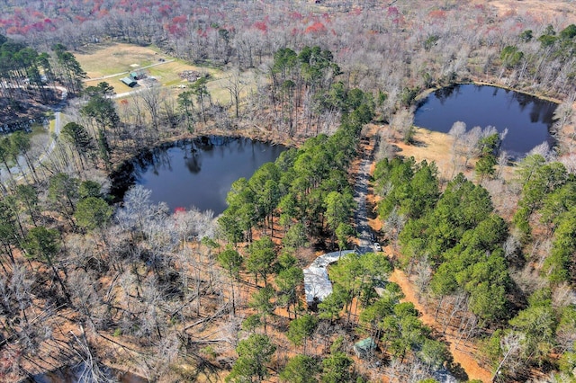 bird's eye view featuring a view of trees and a water view