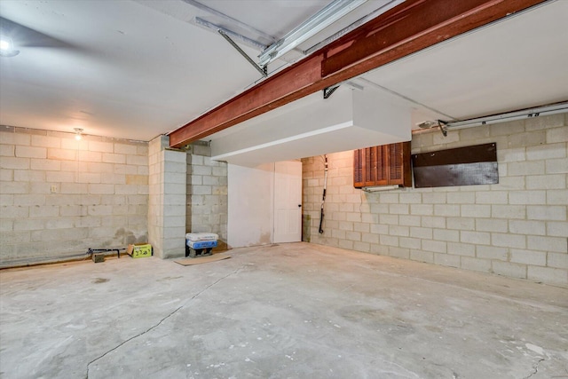 garage with concrete block wall