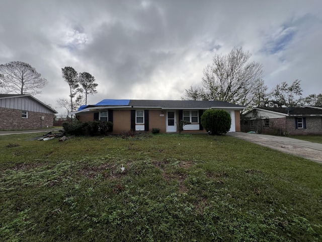 single story home featuring solar panels and a front yard