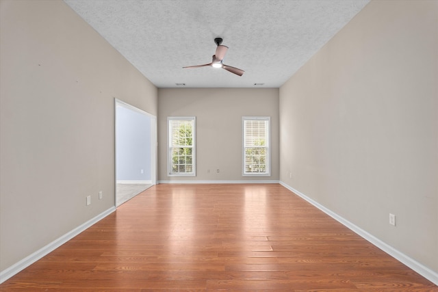 4046 Stone Pass Dr, Graniteville, SC 29829 - spare room with wood finished floors, a ceiling fan, and a textured ceiling