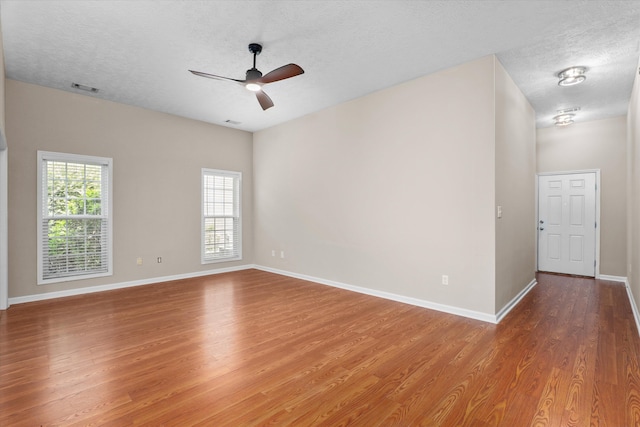 4046 Stone Pass Dr, Graniteville, SC 29829 - spare room with wood finished floors, a textured ceiling, and ceiling fan
