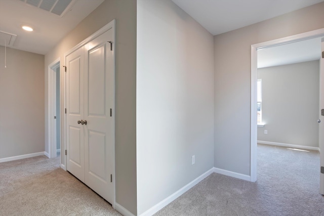 corridor with recessed lighting, carpet flooring, visible vents, baseboards, and attic access