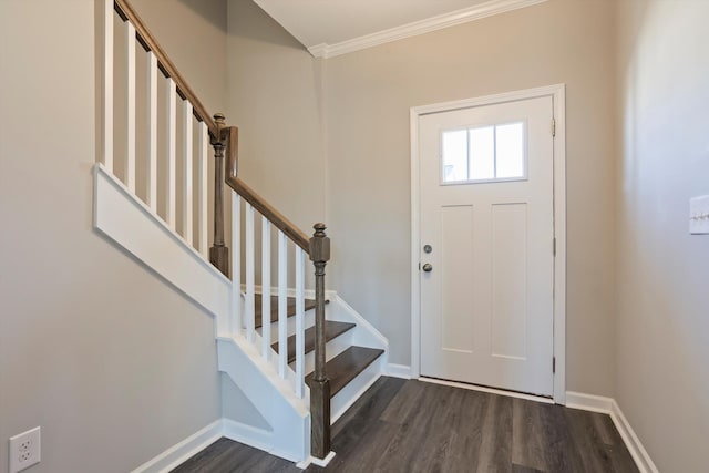 entryway with stairway, baseboards, dark wood-type flooring, and ornamental molding