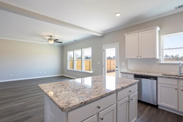 kitchen featuring ornamental molding, dishwasher, and a sink