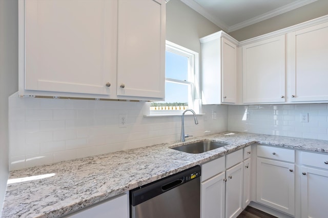 kitchen featuring a sink, white cabinetry, stainless steel dishwasher, backsplash, and crown molding