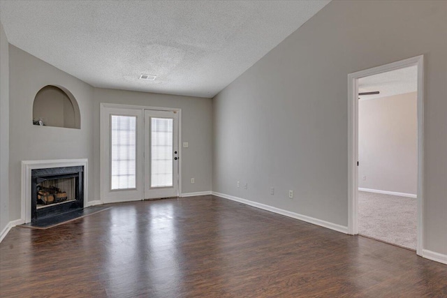 4005 Calypso Dr, Augusta, GA 30909 - unfurnished living room featuring dark wood-type flooring, a premium fireplace, and a textured ceiling