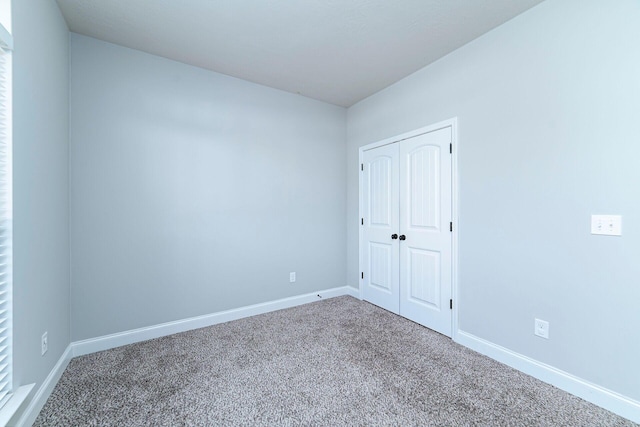 spare room featuring carpet flooring