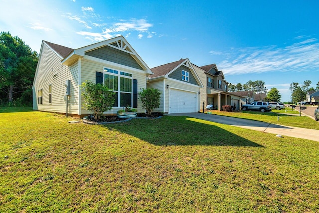 view of front of home with a front yard and a garage