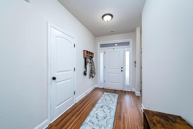 doorway featuring dark wood-type flooring