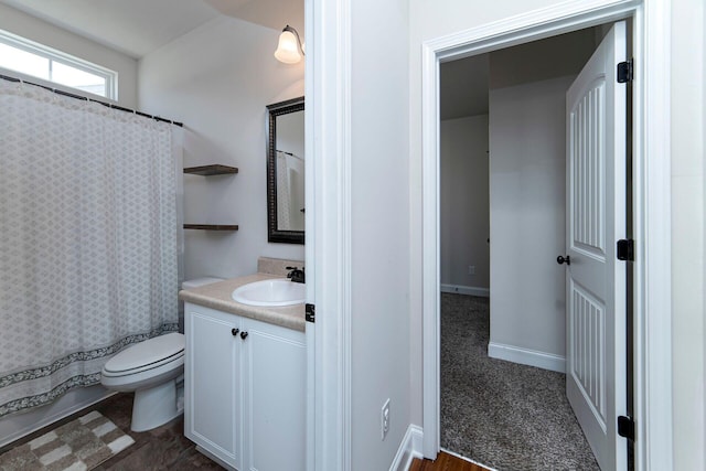 full bathroom featuring vanity, shower / bath combination with curtain, and toilet