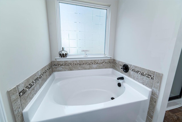 bathroom featuring a tub to relax in