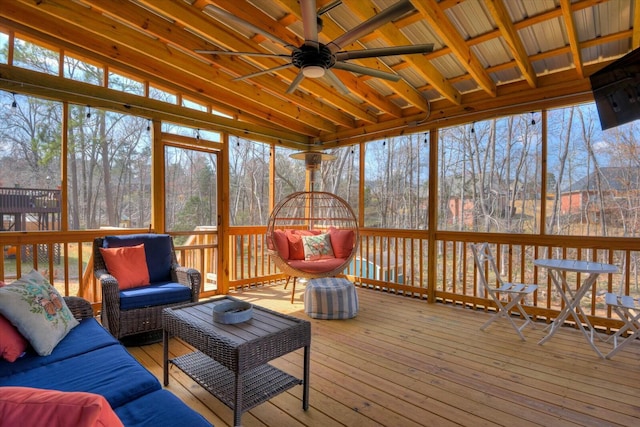 sunroom featuring ceiling fan