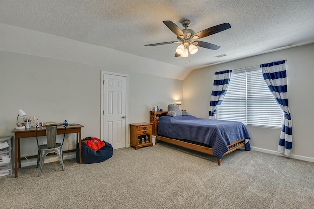 bedroom featuring baseboards, visible vents, ceiling fan, a textured ceiling, and carpet flooring