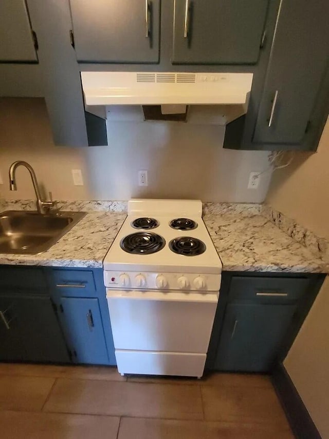 kitchen with light stone countertops, electric range, sink, and extractor fan