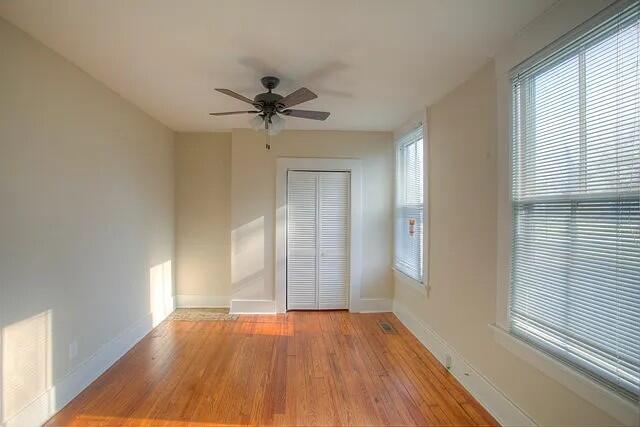 unfurnished room with light hardwood / wood-style floors and ceiling fan