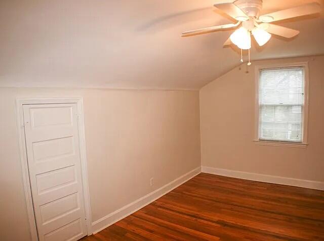 additional living space featuring vaulted ceiling, ceiling fan, and dark hardwood / wood-style floors